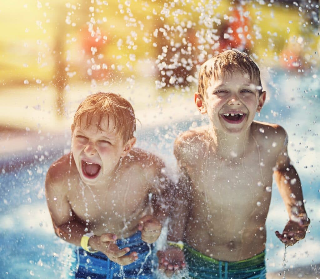 Little boys having fun in waterpark